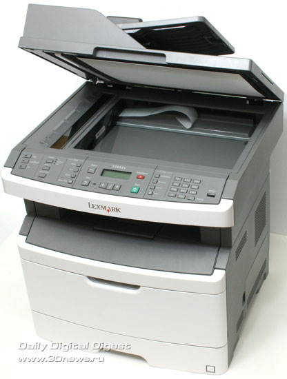Lexmark x364dn. Вид общий. Открыта крышка сканера Lexmark x364dn. Вид общий. Открыта крышка сканера